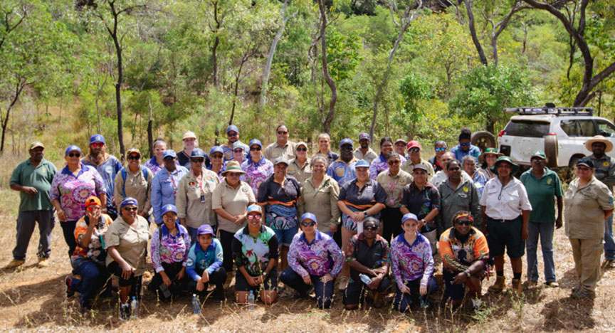 A group of happy women rangers in a bushland setting